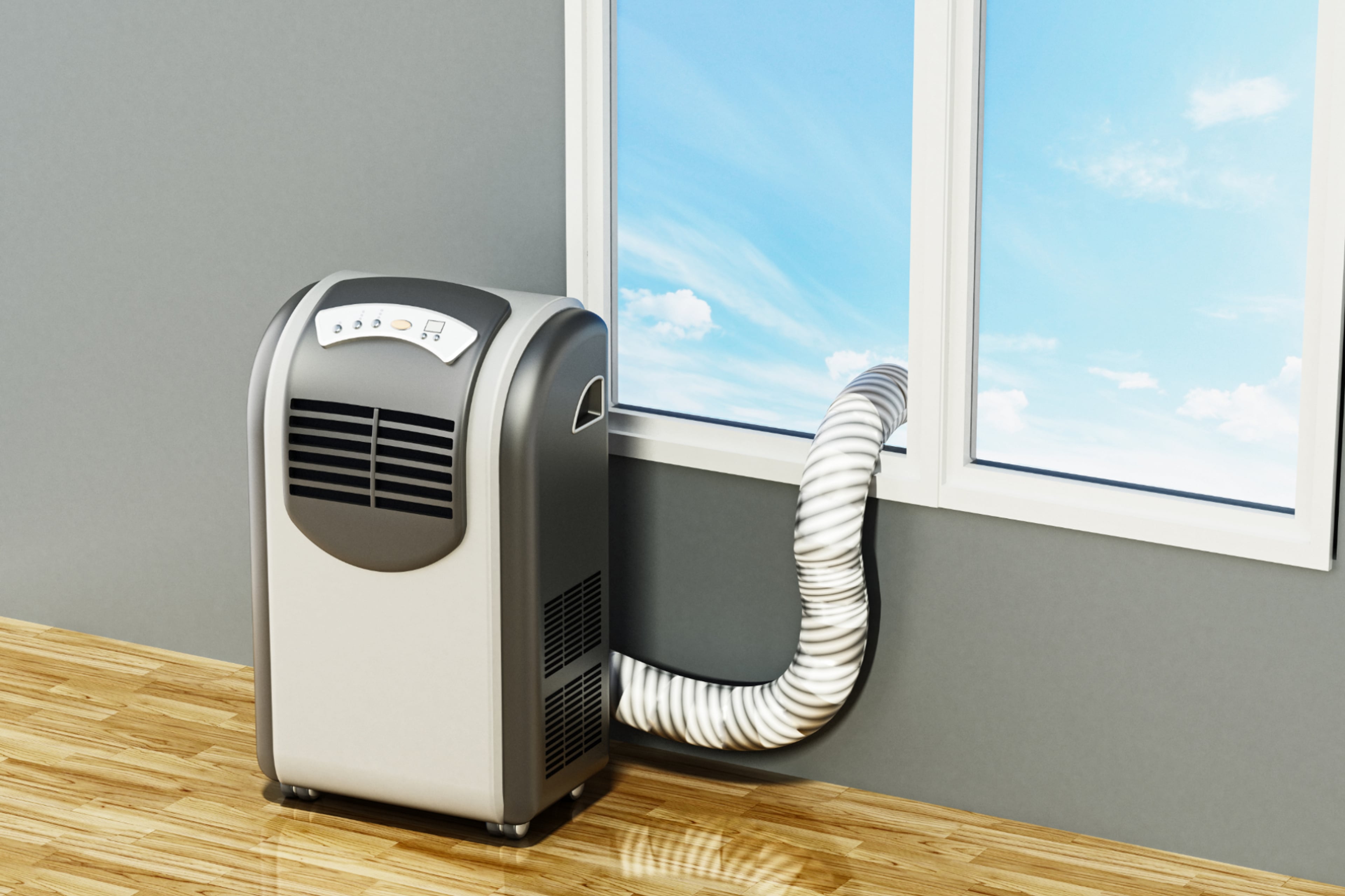 Mobiele airco bij raam. Mobiele airco verbruikt veel energie.
